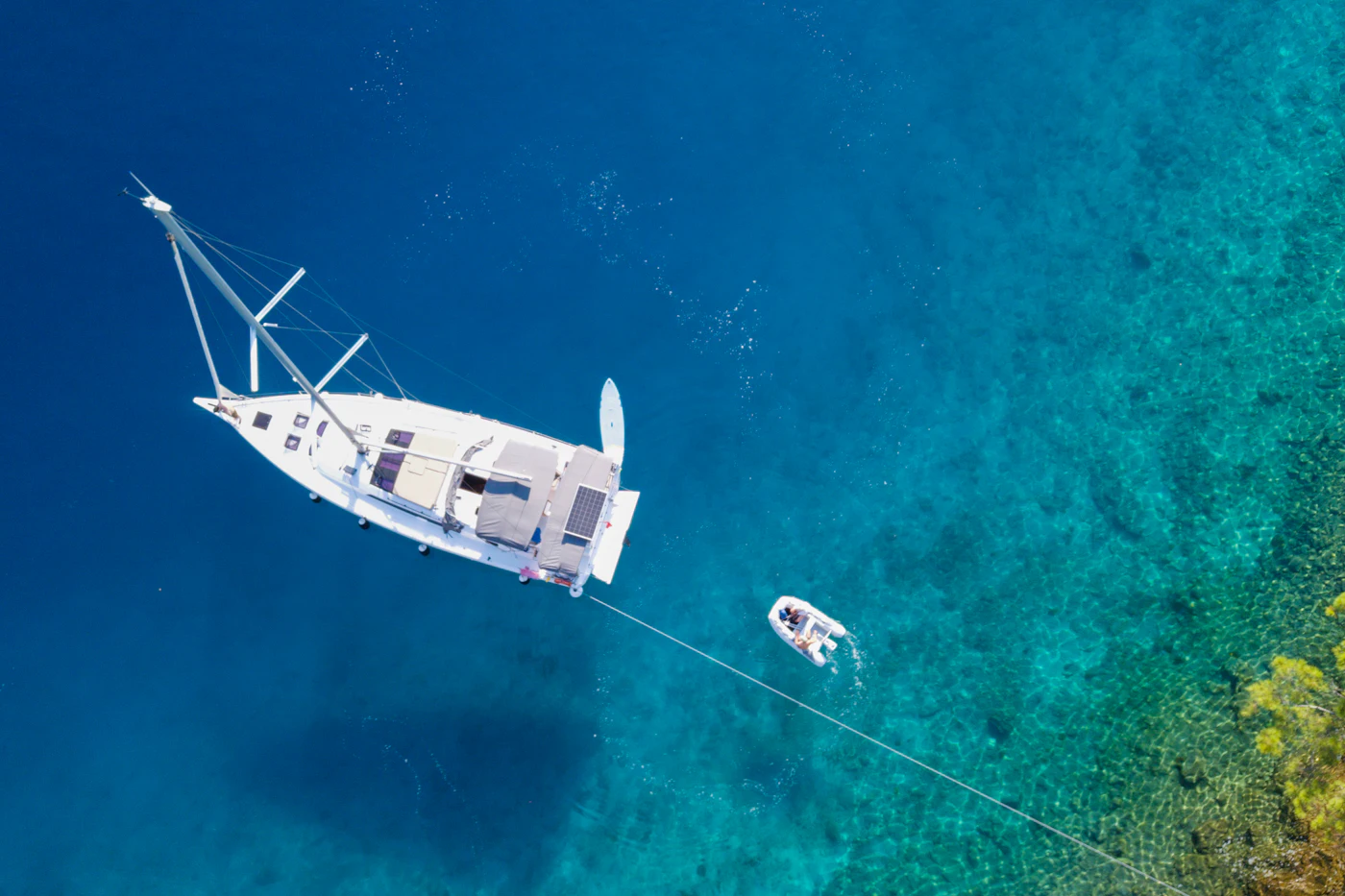 Sailing yacht at anchor seen from above