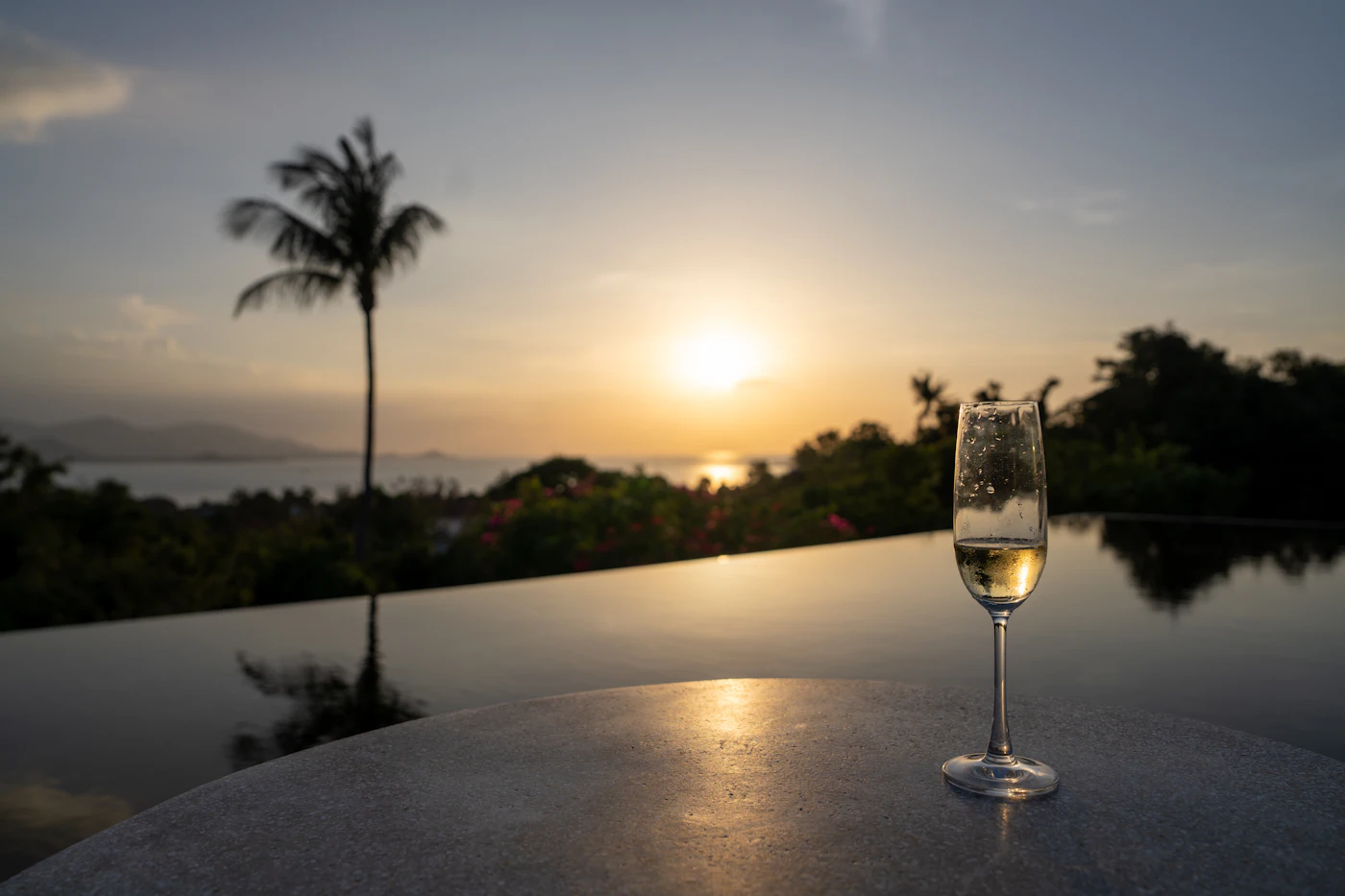 A glass at sunset by the sea